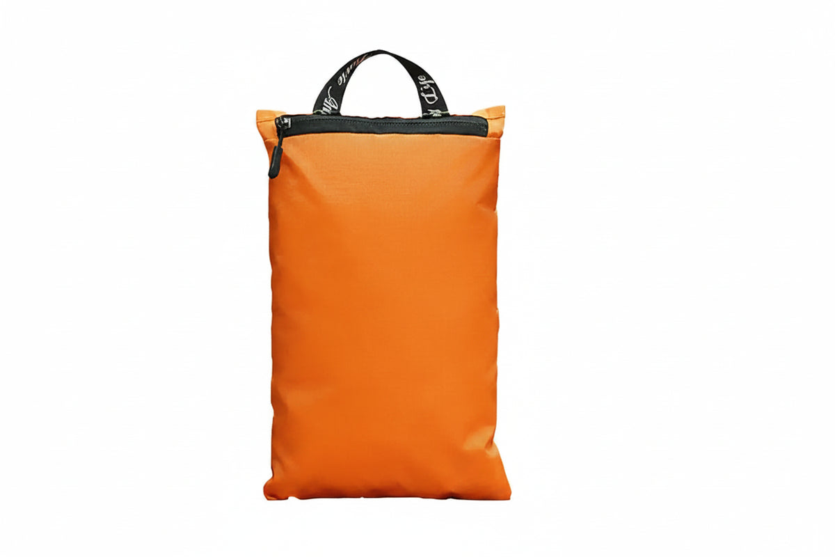 An orange waterproof bag with a black top zipper and handle, featuring a white airplane graphic and the text 'Enjoy a wonderful life. CRO Weeknigh' on the front, set against a plain white background.