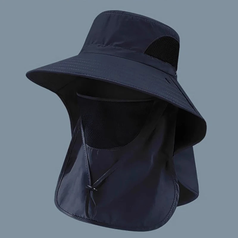 Navy blue sun hat with neck flap on a gray background