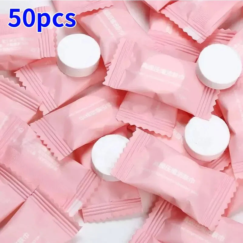 50 pink packets with white caps on a white background