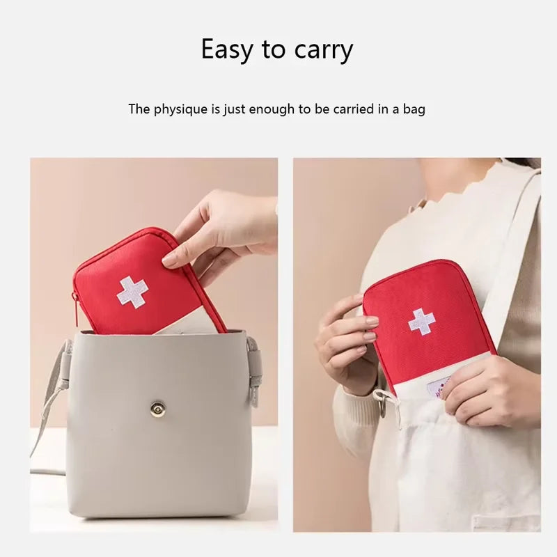 Red first aid kit with a white cross, shown being placed into a gray bag and held by a person.
