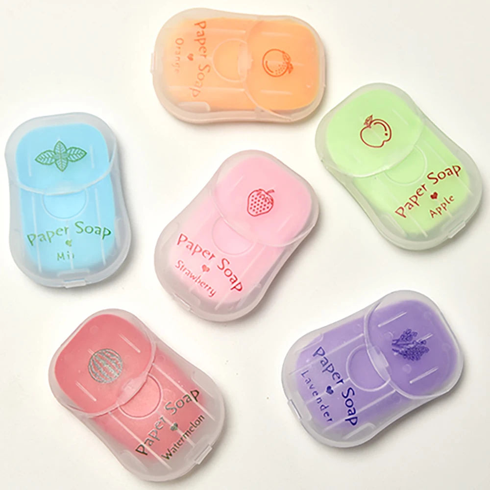 Set of colorful paper soap containers with different scents on a white background