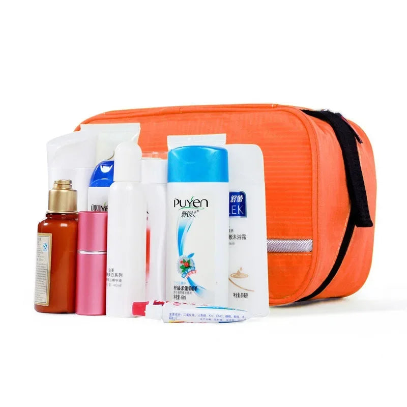 Orange toiletry bag with various skincare products on a white background