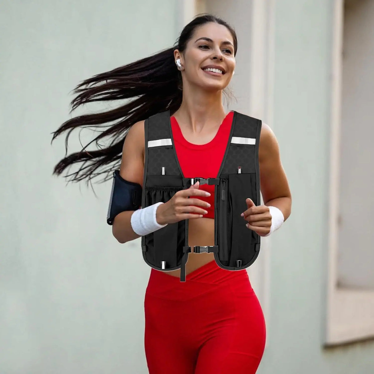 Woman running outdoors wearing a black reflective vest.