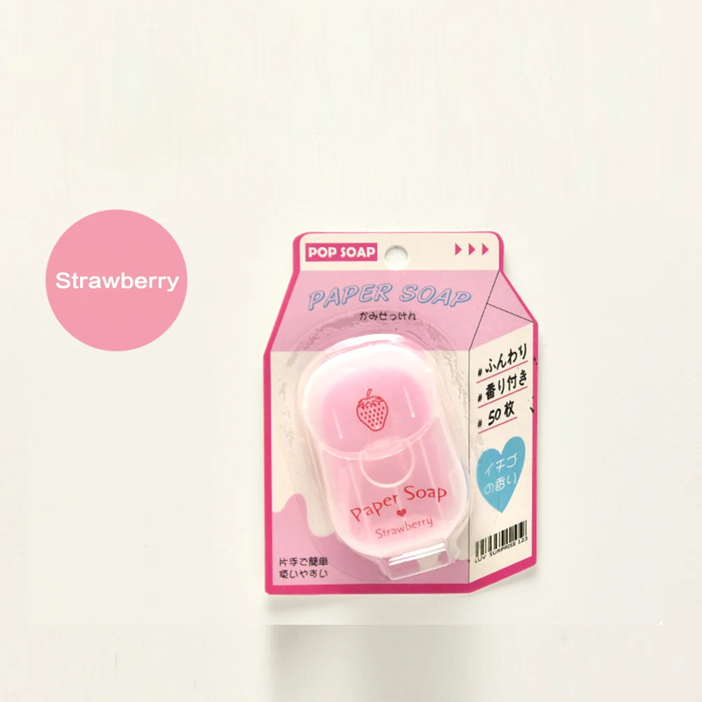 Pink paper soap packaging with strawberry flavor label on a light pink background