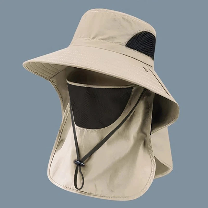 Beige sun hat with face covering on a gray background