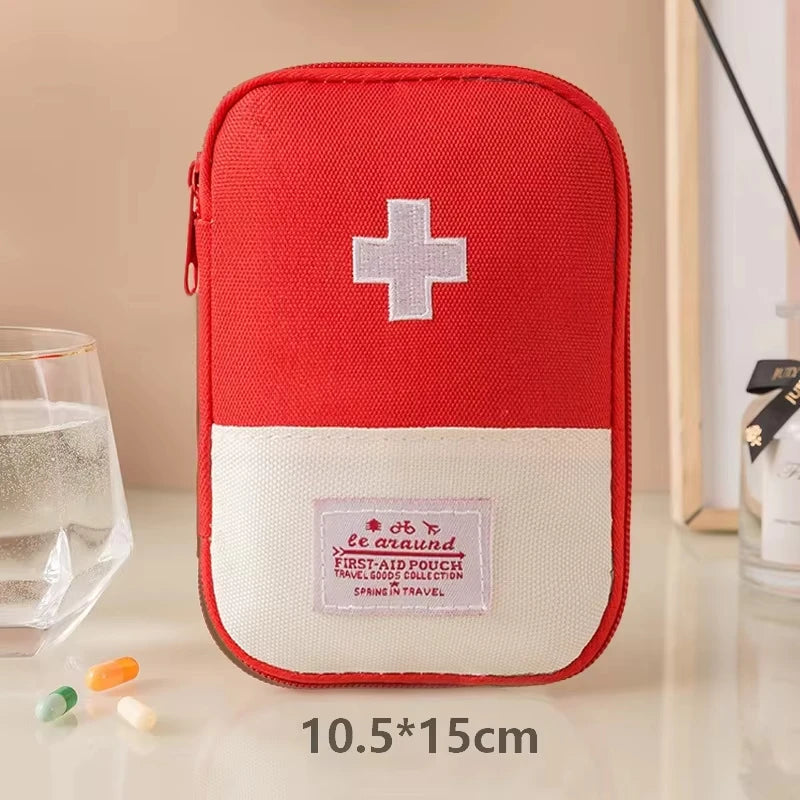 Red and white first aid kit pouch with a cross symbol on a beige background