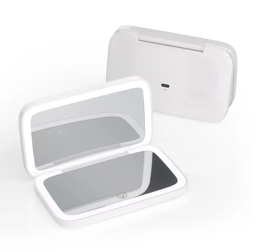 A white rectangular electronic compact case shown open in front and closed in back on a clean white background. The open case reveals a mirrored interior, and the closed case shows a small port on the front.