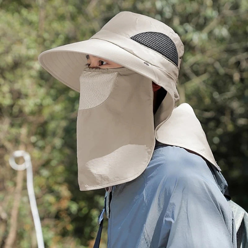 Person wearing a beige sun hat with face covering outdoors