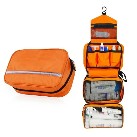 Orange toiletry bag with compartments on a white background