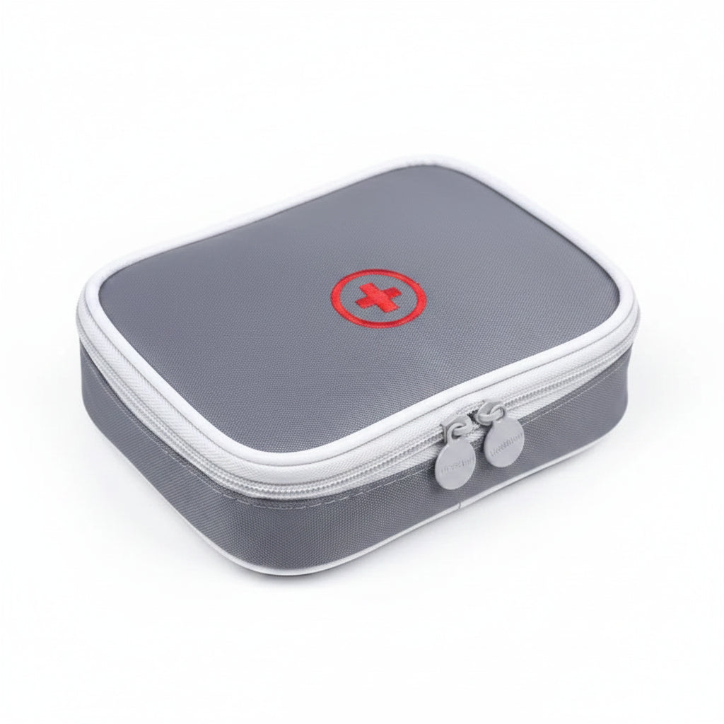 Gray first aid kit with a red cross on a white background
