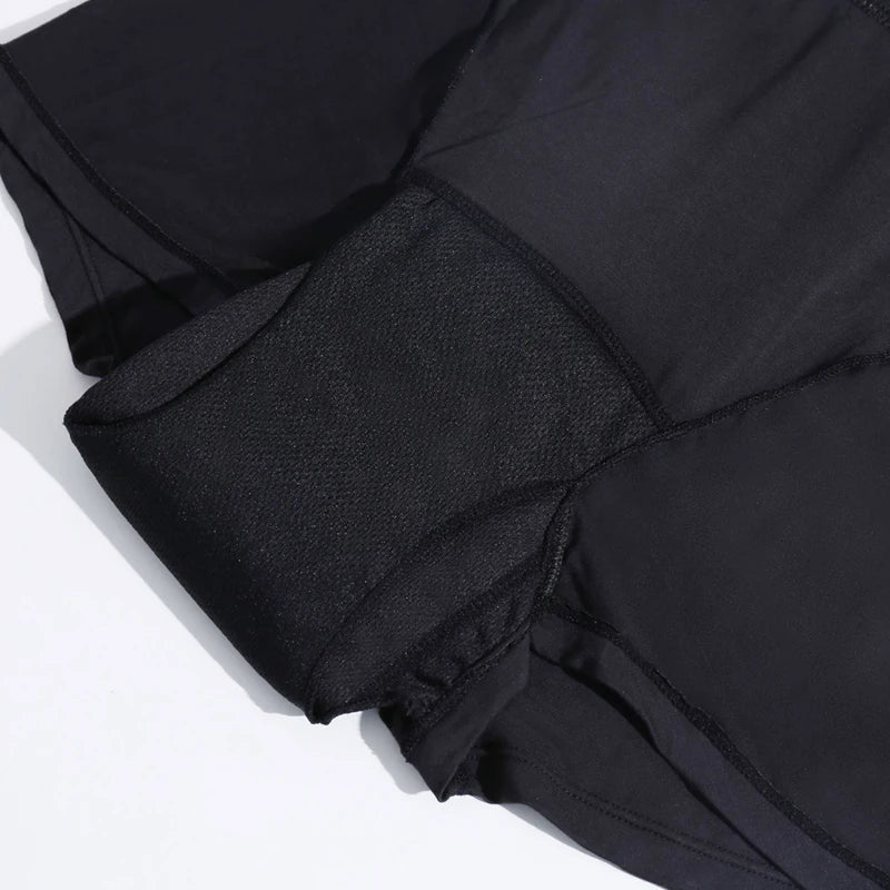 Close-up of a black jacket with a hood on a white background